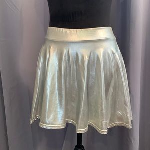 Women’s small silver dance skirt. Apx 13.5” top of waistband to bottom of skirt.